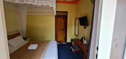 Кровать или кровати в номере Meltonia Luxury Inn