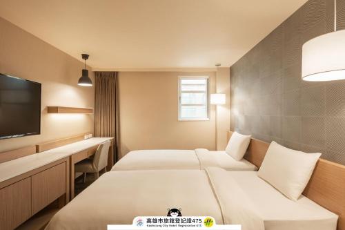 Postel nebo postele na pokoji v ubytování Kindness Hotel-Jue Ming