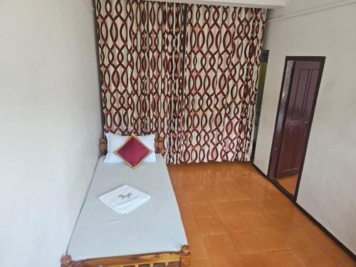 a room with a table with a napkin on it at Cicily Cottage in Munnar