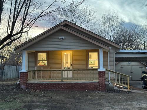 a small house with a front porch with a window at Adorable New West 3 BR 2 BA SMRT TV Coffee in Wichita