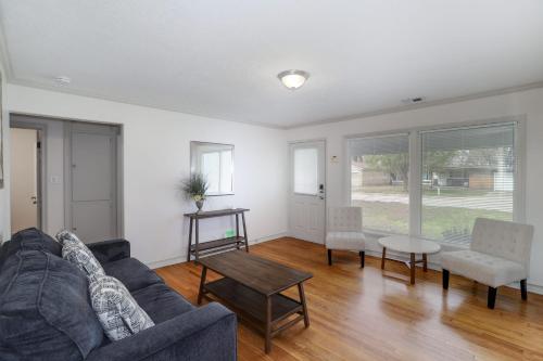 a living room with a couch and a table at Spacious West Side Home away from Home! in Wichita