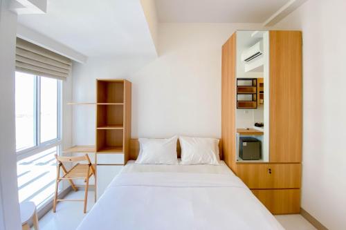 Ένα ή περισσότερα κρεβάτια σε δωμάτιο στο Chic and Cozy Studio at Tokyo Riverside PIK 2 Apartment By Travelio