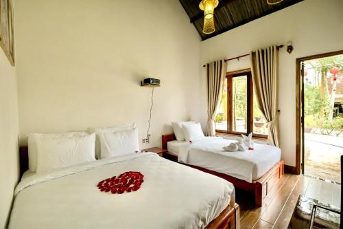 Ένα ή περισσότερα κρεβάτια σε δωμάτιο στο Pine Garden Homestay Hue