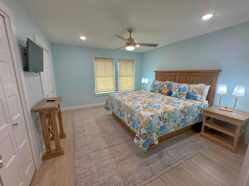 a bedroom with a bed and a television in it at C1 At Little Bay Landing in Rockport