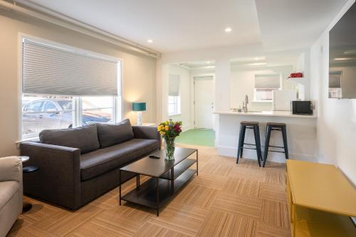a living room with a couch and a table at Little Mod Hotel at the University in Charlottesville