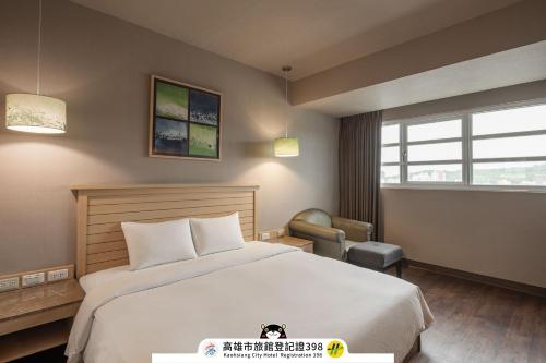 Postel nebo postele na pokoji v ubytování Kindness Hotel-Qixian