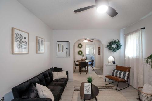 a living room with a couch and a table at Home Sweet Home - Loft 3 BR - 1 BA WIFI SMART TV in Wichita