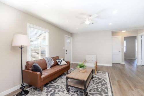a living room with a couch and a table at SUPER CUTE 3 BR 1 BA WIFI Smrt TV 2 Living RM in Wichita