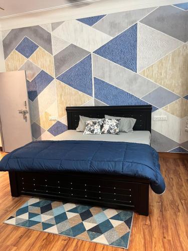 a bed with two pillows on it in a bedroom at Kuteeram - Create Memories in Secunderabad