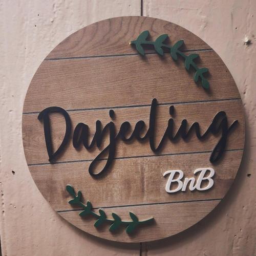 a wooden sign that reads my way my big at Darjeeling BnB in Darjeeling