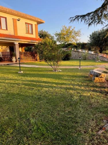 a house with a yard with green grass at Room24 Relax & Wellness in Genzano di Roma