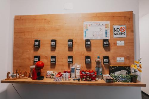 a bulletin board with no smoking signs on a wall at Villa Rosa in Timişoara