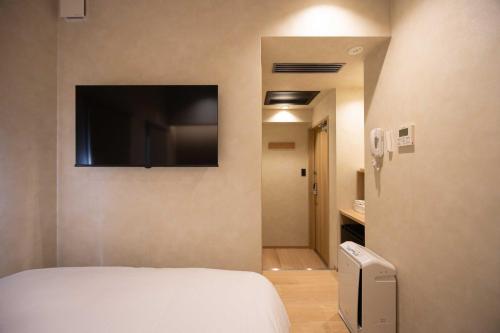 Postel nebo postele na pokoji v ubytování Hotel Paul House