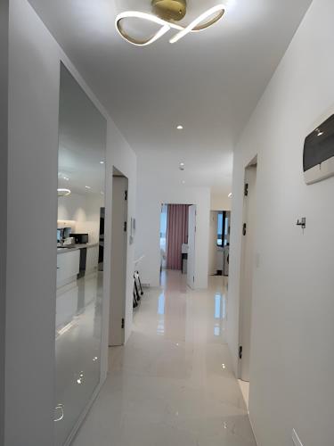 a hallway with white walls and a ceiling at 318 Stay in Seoul