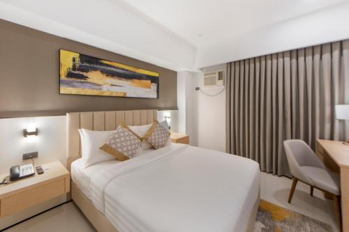 Postel nebo postele na pokoji v ubytování Amarah Hotel