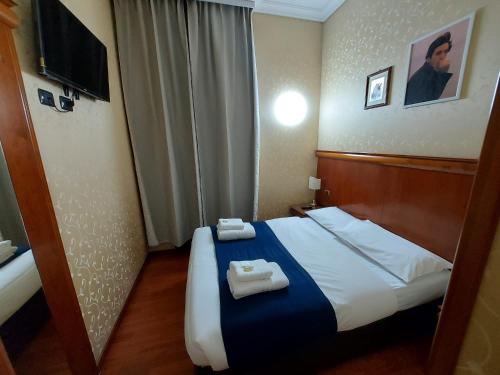 Postel nebo postele na pokoji v ubytování Hotel Positano 2 MIMOSA