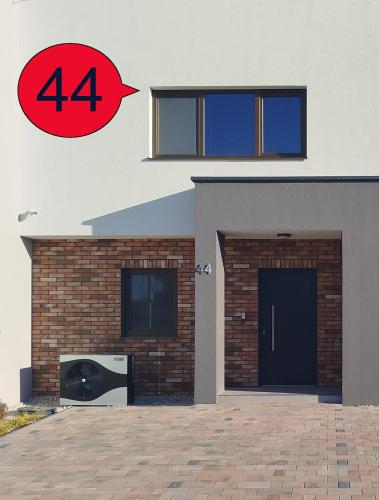 a house with the number on it at New Townhouse Apartment in Šamorín