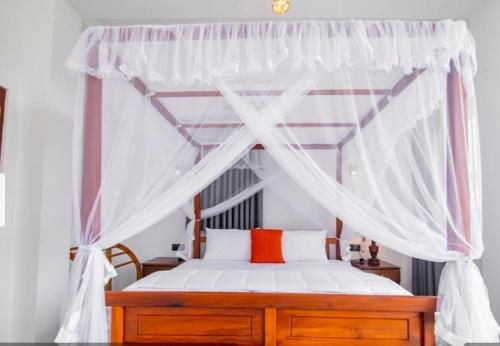 Ένα ή περισσότερα κρεβάτια σε δωμάτιο στο Blue Surf Villa