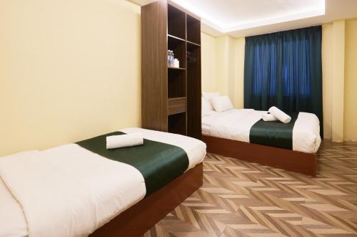 Postel nebo postele na pokoji v ubytování Fast Hotel Setapak Near Tunku Abdul Rahman UMT KL