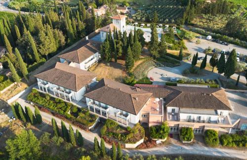an overhead view of a house with a roof at Cappuccina Country Resort in San Gimignano