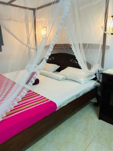 Postel nebo postele na pokoji v ubytování Seaside Coco Villa