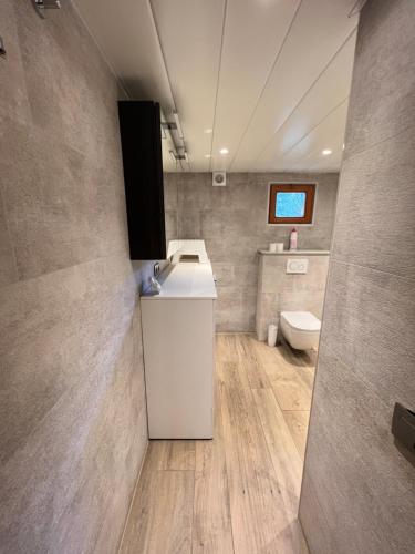 a bathroom with a sink and a toilet at Panoramic Bungalow Sint Gillis-Waas in Sint-Gillis-Waas