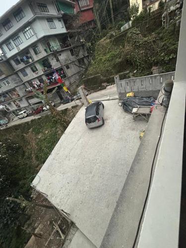 a car parked on top of a roof at Arcane viewfinder homestay in Gangtok