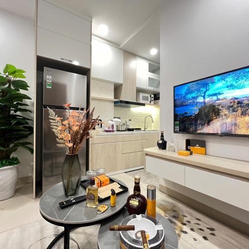 a kitchen with a tv and a table in a room at The Literature'N Central Hotel and Travel Ha Noi 177 in Hanoi