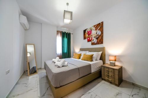 A bed or beds in a room at Seaside Apartments in Agkisaras 2