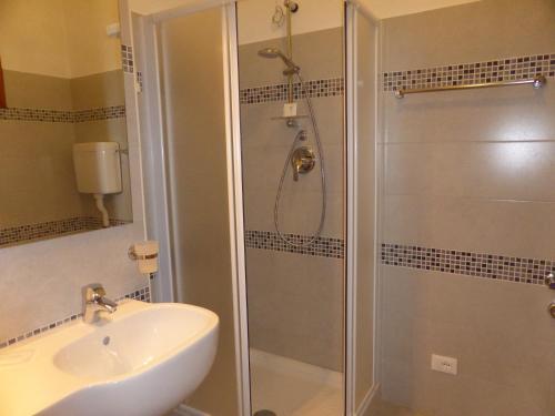a bathroom with a shower and a sink at Residence Green Park in Ventimiglia