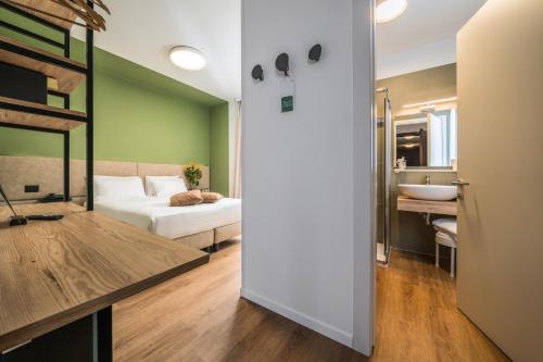 Posteľ alebo postele v izbe v ubytovaní Hotel Oasi Verde