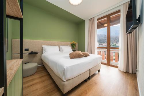 Posteľ alebo postele v izbe v ubytovaní Hotel Oasi Verde