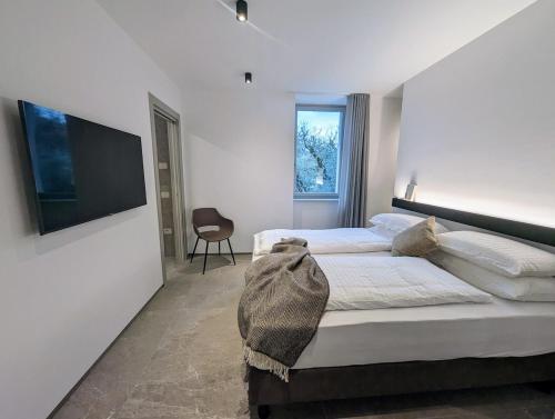 En eller flere senge i et værelse på Villa Sembenini Suite with terrace