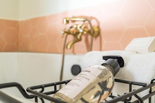 a bottle of wine sitting in a shopping cart at The Victorian Manor in Victoria Falls