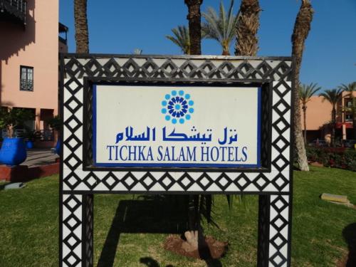 a sign for a titzka saliya hotels in a park at Manis Apartment Set in a Hotel Area in Marrakesh