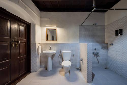 Koupelna v ubytování Sliceinn Escapes Pushpanjali - Madikeri, Coorg