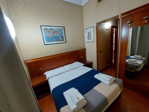 Postel nebo postele na pokoji v ubytování Hotel Positano 2 MIMOSA