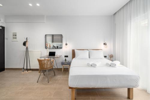 Ένα ή περισσότερα κρεβάτια σε δωμάτιο στο Rizes Suites Metro Dafni