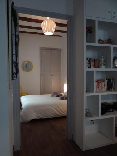 a bedroom with a bed and a light in a doorway at Valencia what else... in Valencia