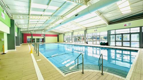 a large swimming pool in a large building at Beach Retreat in Filey
