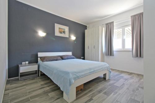 Postel nebo postele na pokoji v ubytování Apartment Dragomir 1052