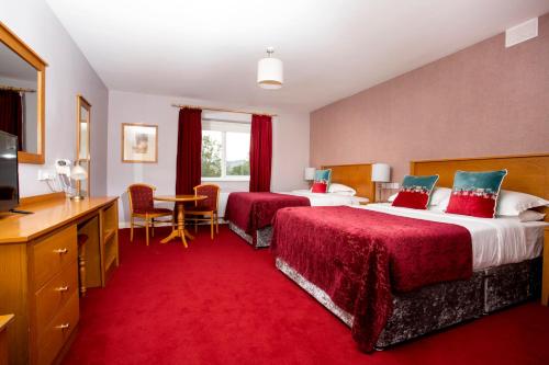 Postel nebo postele na pokoji v ubytování Donegal Manor
