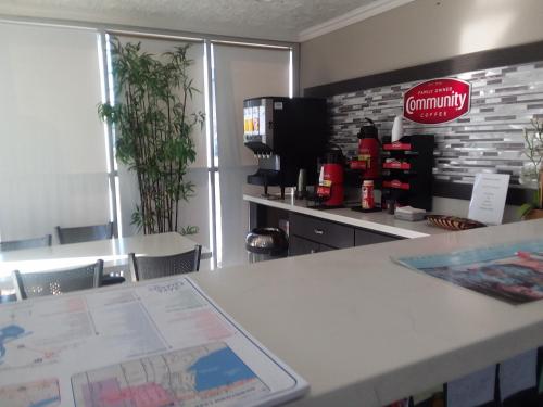 a coffee shop with a map on a counter at Howard Johnson by Wyndham Historic Lake Charles in Lake Charles