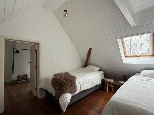 Postel nebo postele na pokoji v ubytování Hoeve Gensters