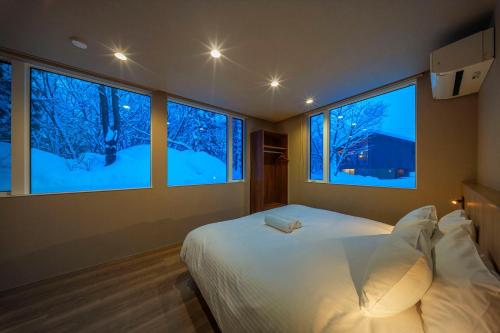 Rúm í herbergi á Chalet Infinity