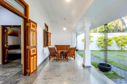 a dining room with a table and chairs at Pleasure Villa in Matara