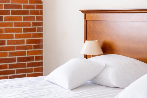 Кровать или кровати в номере Hotel Szymbark