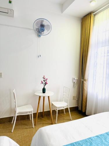 Postel nebo postele na pokoji v ubytování T&T Homestay Hue