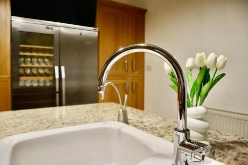 a kitchen counter with a sink and a faucet at The Church E in Manchester