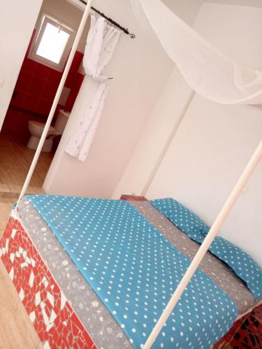 Una cama o camas en una habitación de Cocotiers Nianing